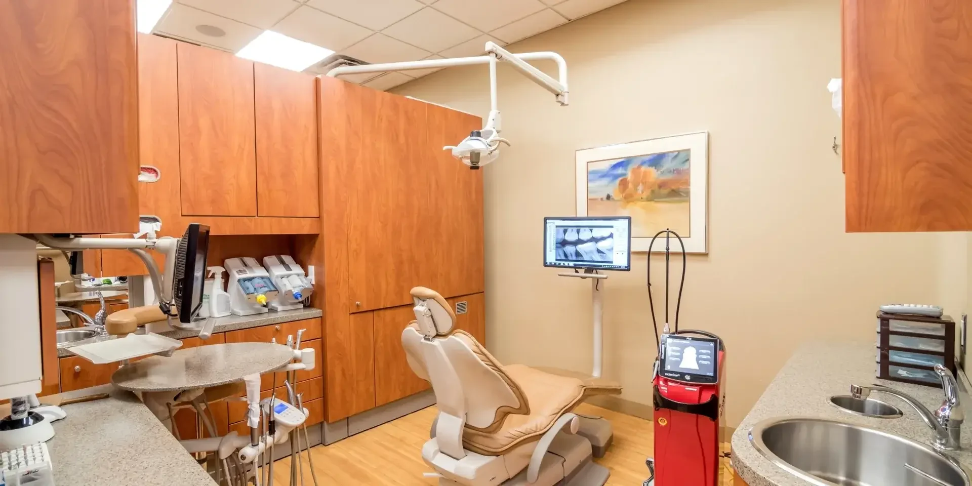 Treatment room with overhead light and digital X-ray display